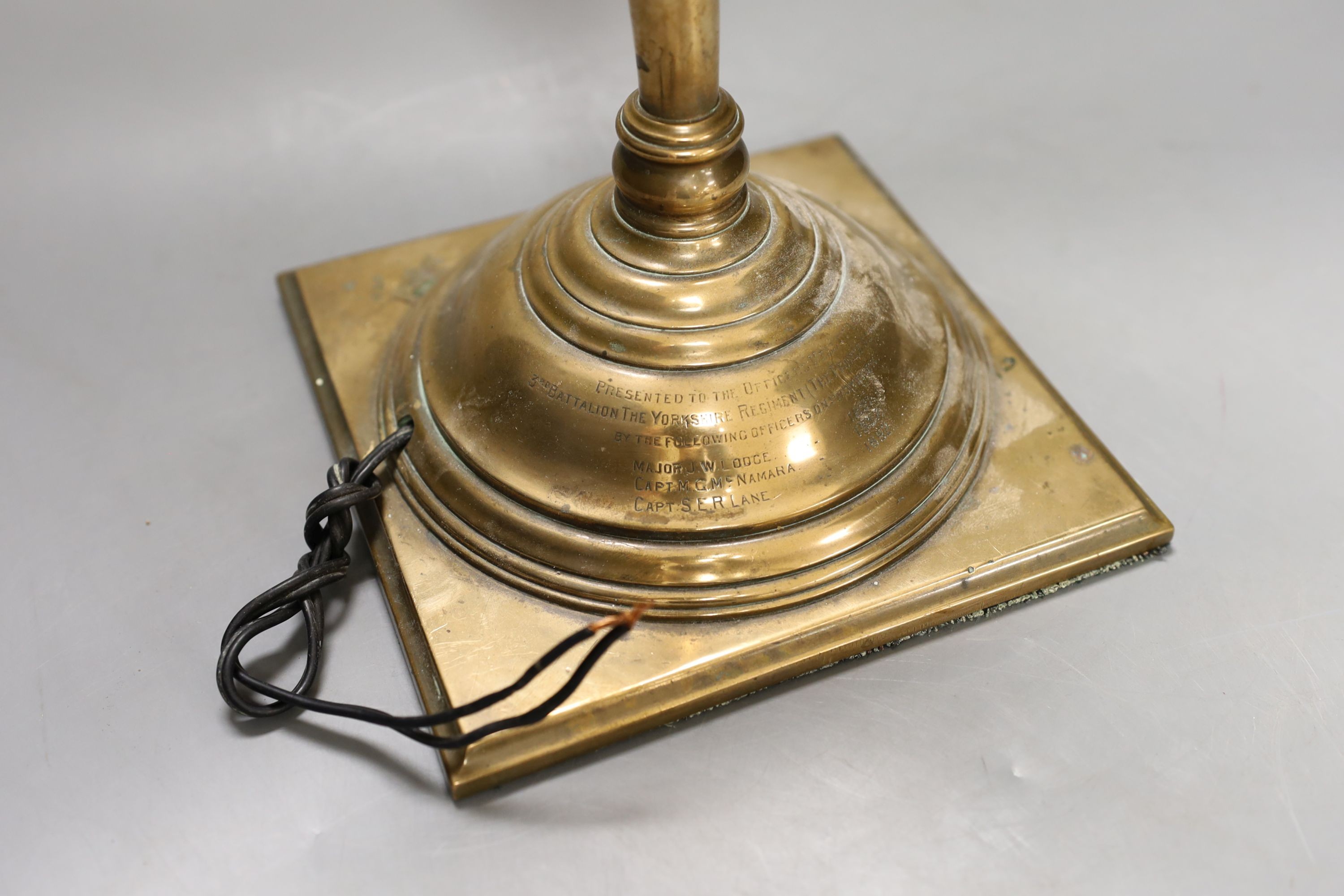 A late Victorian copper alloy table lamp, engraved inscription ‘presented to the officers mess of the 3rd battalion of the Yorkshire regiment (the princess of Wales’ own) by the following officers on promotion Major J.W